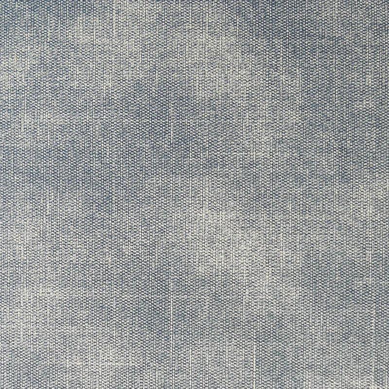Close-up of denim blue fabric with visible textured weave pattern