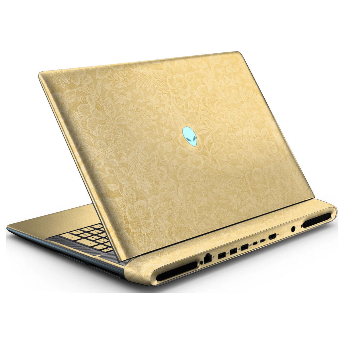 Rear left three-quarter view of an open Alienware 18 Area-51 (2025) with Vintage Gold Hibiscus skin, showing the floral lid and keyboard deck to the left.