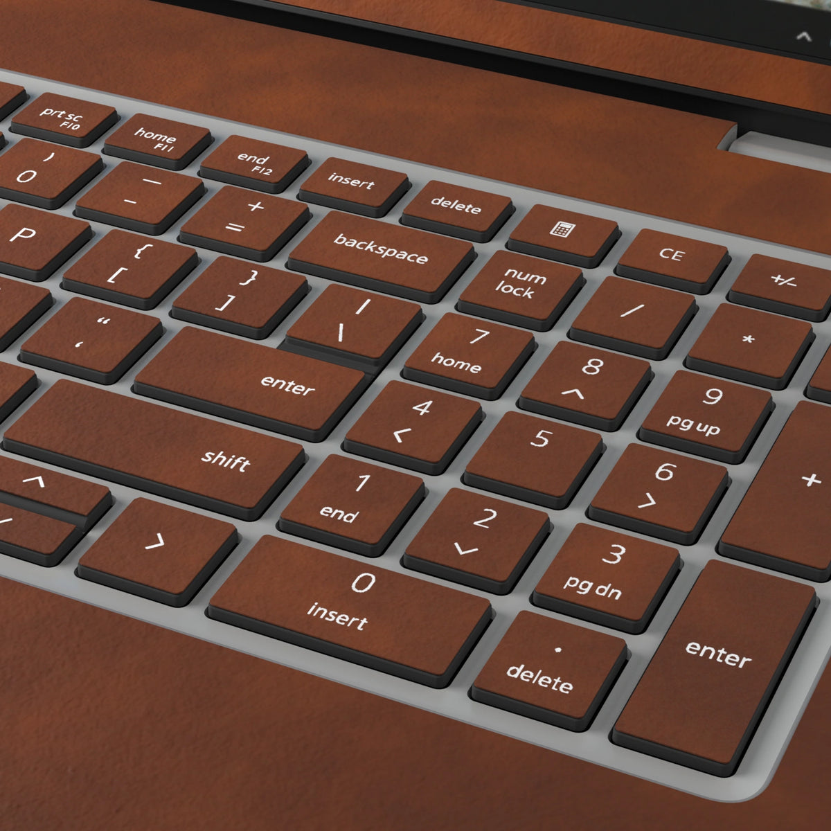 Wood Coffee scrub-textured synthetic leather Dell business laptop skin, macro view. Rendered on Dell Pro 16 PC16250 as a reference; exact cut layout follows the selected model and coverage.