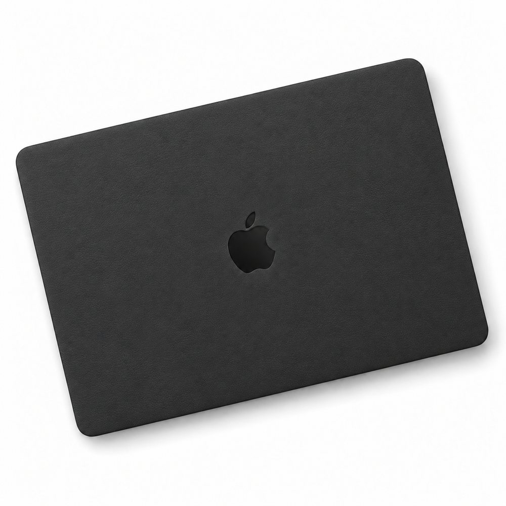Black plain-colour MacBook skin coverage illustration: top lid only. Cut layout varies by model.