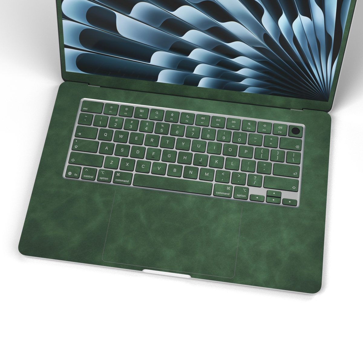 Green scrub-textured synthetic leather MacBook skin. Wide keyboard and inside material detail. Air 15.3 M3-M5 shared material/installation reference; exact cutouts and included pieces follow selected model and coverage. Laptop not included.