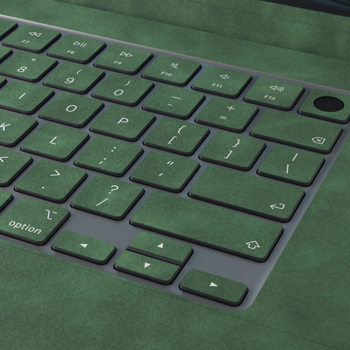 Green scrub-textured synthetic leather MacBook skin. Close-up of the actual scrub-textured material finish. Air 15.3 M3-M5 shared material/installation reference; exact cutouts and included pieces follow selected model and coverage. Laptop not included.