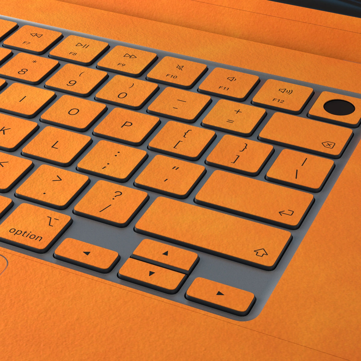Orange scrub-textured synthetic leather MacBook skin. Close material and keyboard detail. Air 15.3 M3-M5 shared material/installation illustration; actual cutouts and included pieces follow the selected model and coverage. Laptop not included.