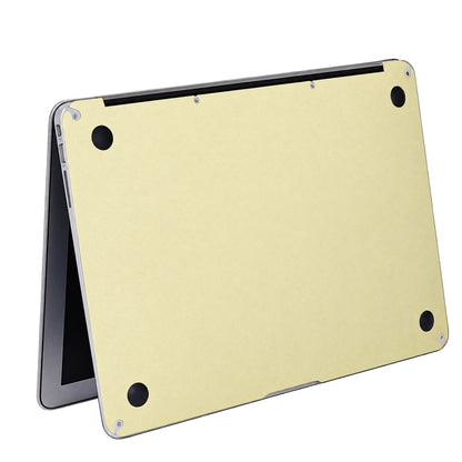 AI-assisted champagne gold MacBook skin visualisation showing the bottom wrap with clear rubber feet. Cut layout varies by model.