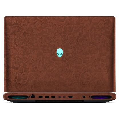 Rear view of an open Alienware 18 Area-51 (2025) with Classic Brown Hibiscus skin, showing the floral outer lid, rear ports and vents.