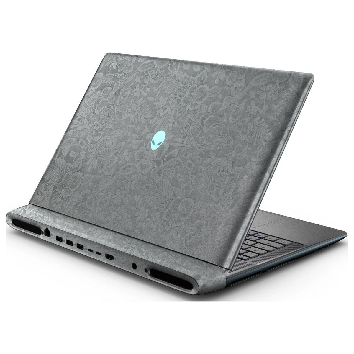 Rear right three-quarter view of an open Alienware 18 Area-51 (2025) with Classic Gray Hibiscus skin, showing the floral lid and keyboard deck to the right.
