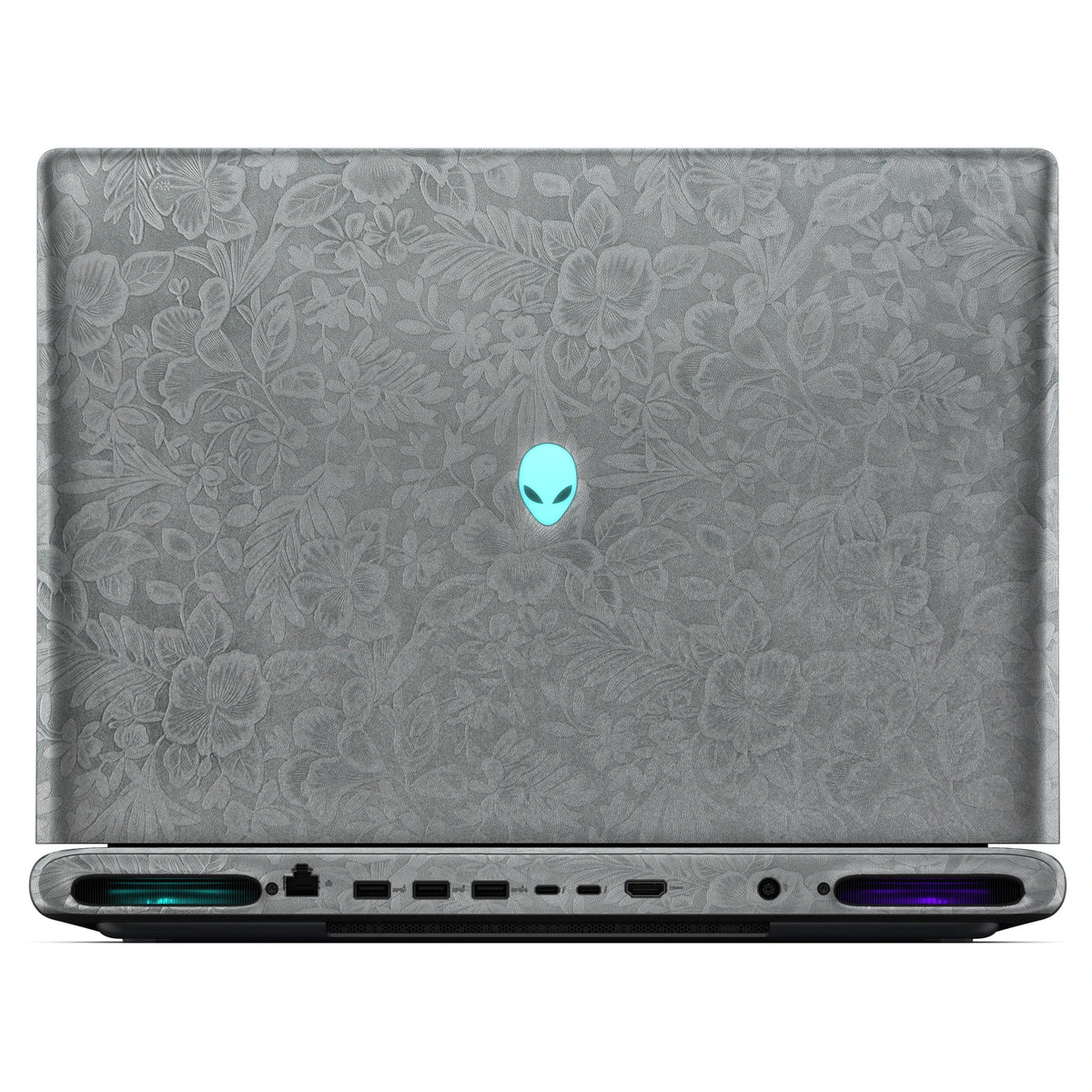 Rear view of an open Alienware 18 Area-51 (2025) with Classic Gray Hibiscus skin, showing the floral outer lid, rear ports and vents.