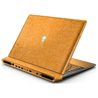 Rear right three-quarter view of an open Alienware 18 Area-51 (2025) with Sunny Yellow Hibiscus skin, showing the floral lid and keyboard deck to the right.