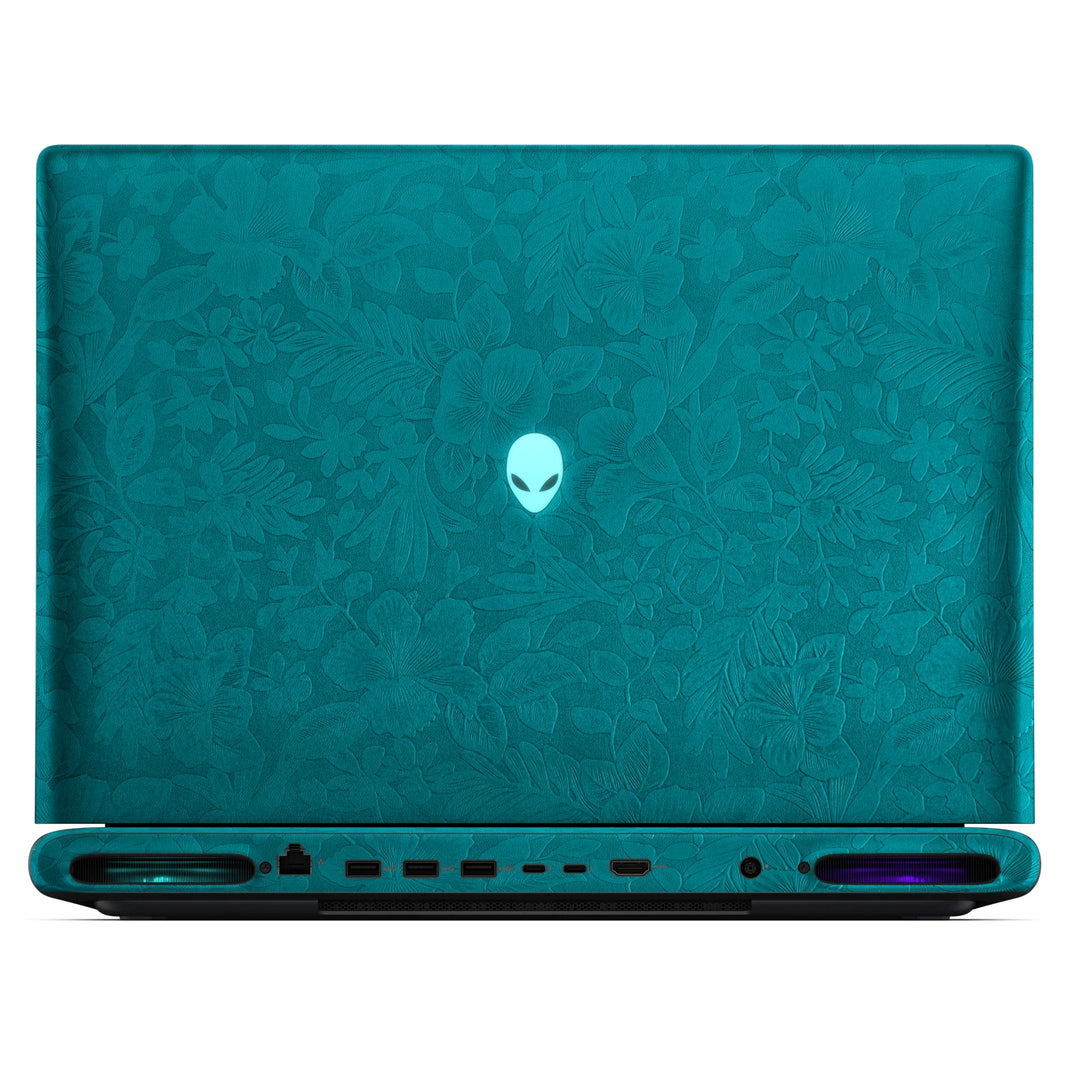 Rear view of an open Alienware 18 Area-51 (2025) with Tropical Teal Hibiscus skin, showing the floral outer lid, rear ports and vents.