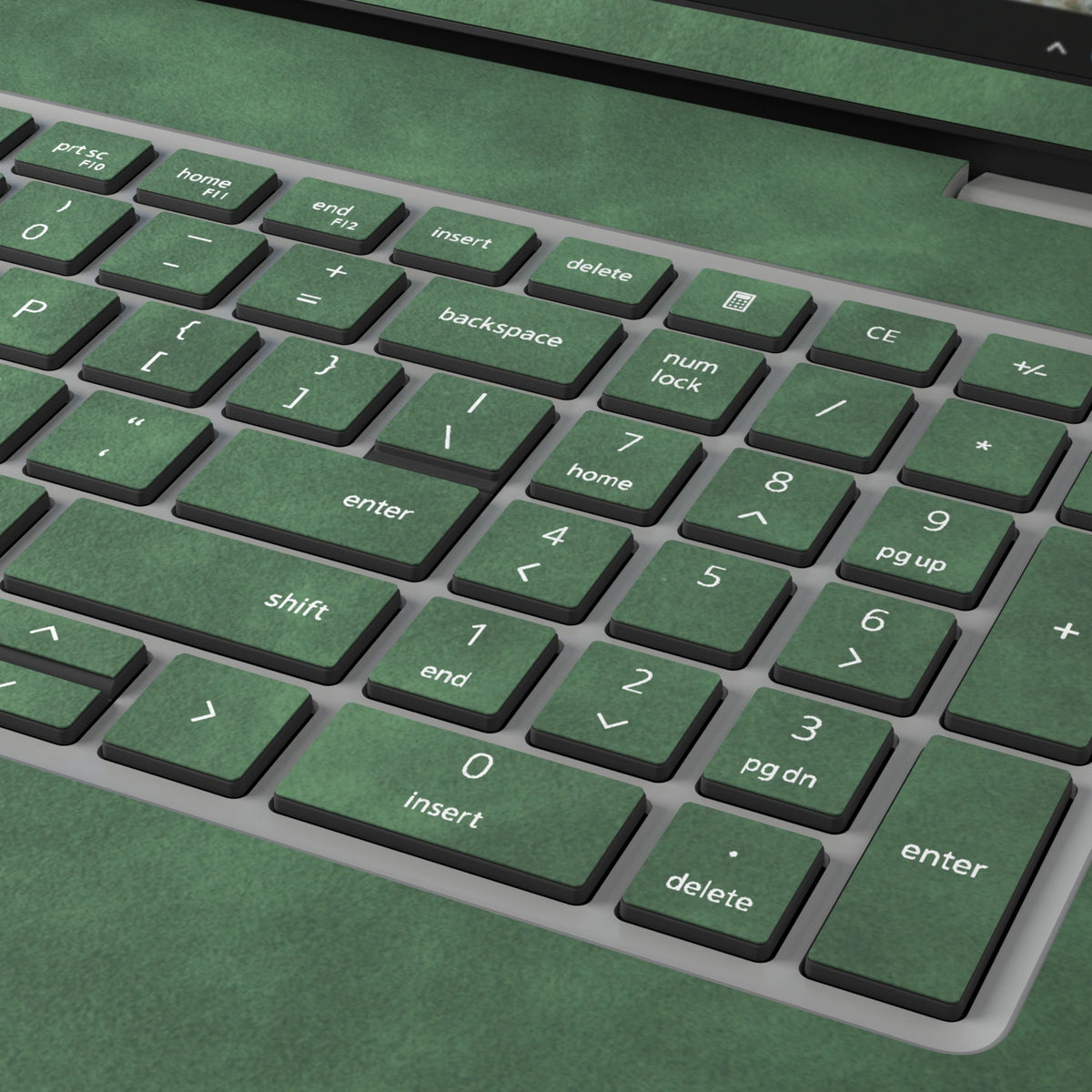 Green scrub-textured synthetic leather Dell business laptop skin, macro view. Rendered on Dell Pro 16 PC16250 as a reference; exact cut layout follows the selected model and coverage.