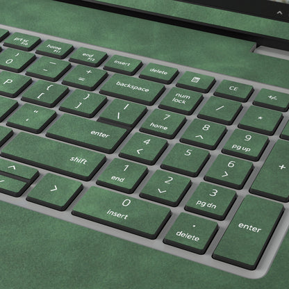Green scrub-textured synthetic leather Dell business laptop skin, macro view. Rendered on Dell Pro 16 PC16250 as a reference; exact cut layout follows the selected model and coverage.