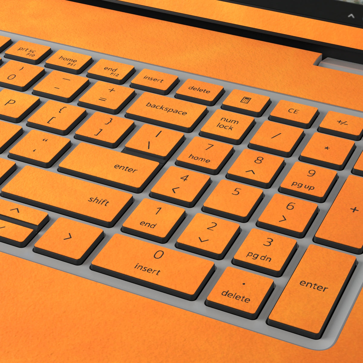 Orange scrub-textured synthetic leather Dell business laptop skin, macro view. Rendered on Dell Pro 16 PC16250 as a reference; exact cut layout follows the selected model and coverage.