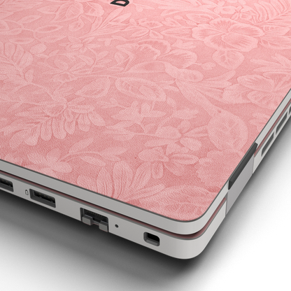 Hibiscus-embossed top lid material close-up of Blush Pink Hibiscus synthetic leather skin, rendered on Dell Pro 16 (PC16250) as a model reference.