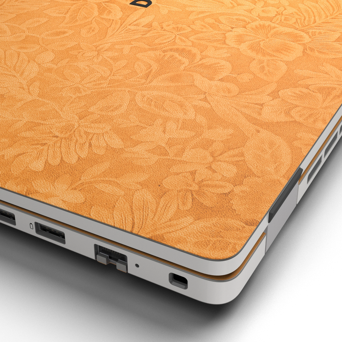 Hibiscus-embossed top lid material close-up of Sunny Yellow Hibiscus synthetic leather skin, rendered on Dell Pro 16 (PC16250) as a model reference.