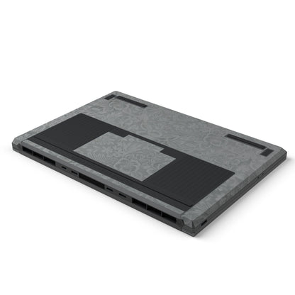 Dwantran Hibiscus Lenovo laptop skin in Classic Gray, showing an oblique view of the laptop underside on a white background.