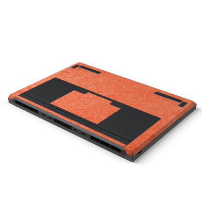 Dwantran Hibiscus Lenovo laptop skin in Sunset Orange, showing an oblique view of the laptop underside on a white background.