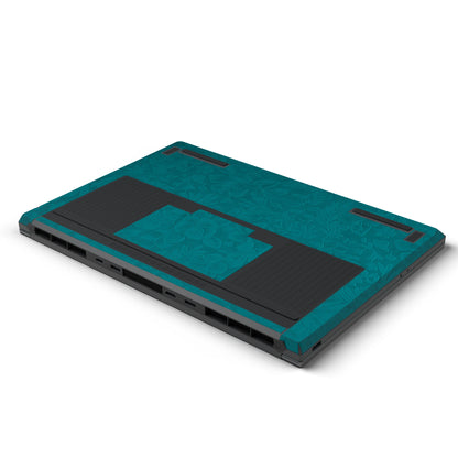 Dwantran Hibiscus Lenovo laptop skin in Tropical Teal, showing an oblique view of the laptop underside on a white background.