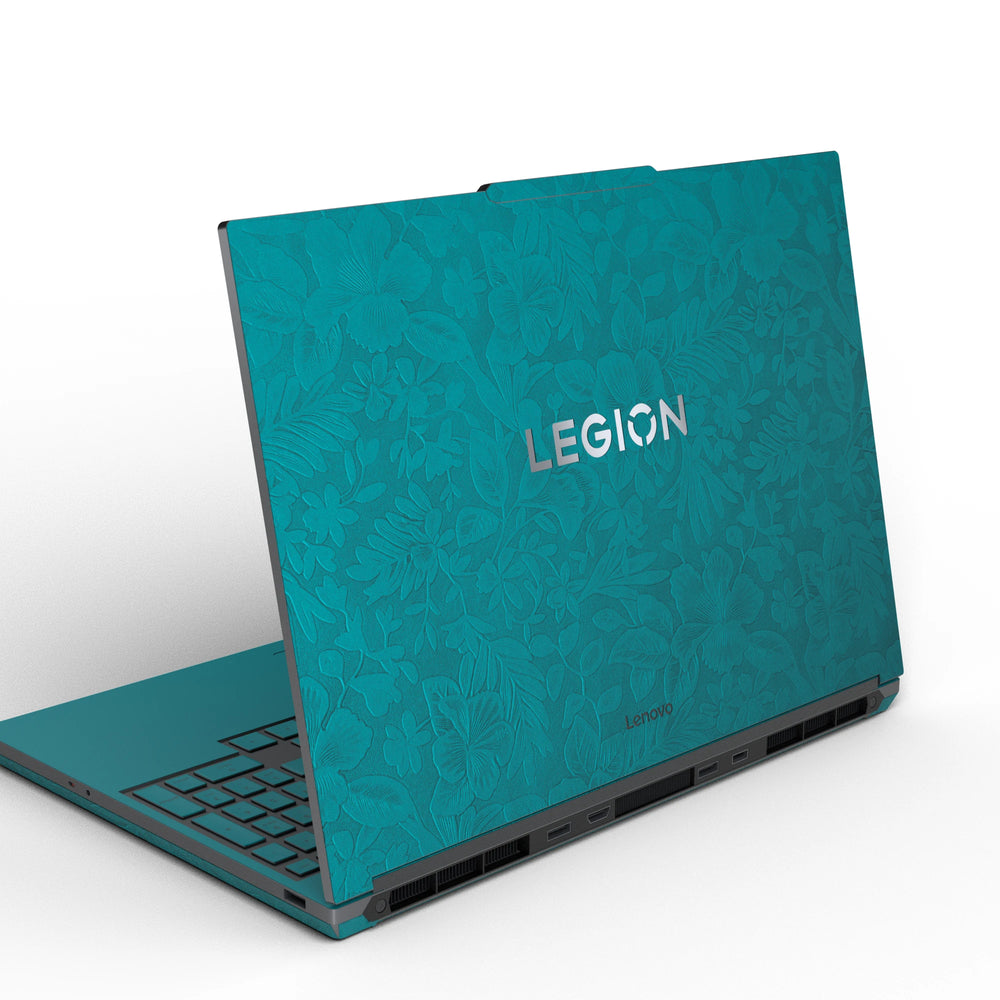 Dwantran Hibiscus Lenovo laptop skin in Tropical Teal, showing an oblique view of the laptop lid on a white background.