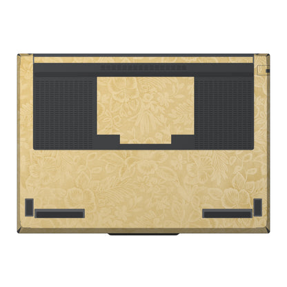 Dwantran Hibiscus Lenovo laptop skin in Vintage Gold, showing a bottom view of the laptop on a white background.