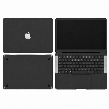 Black plain-colour MacBook skin coverage illustration: top lid, inside, keycap stickers, bottom and screen edge. Cut layout varies by model.