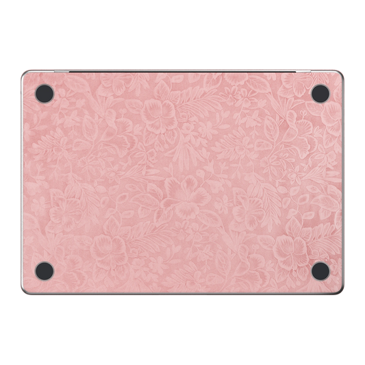 Blush Pink Hibiscus. Embossed D bottom material illustration. Rendered on MacBook Air 15.3-inch M3–M5; actual cutouts and supplied pieces follow the selected MacBook model and coverage.