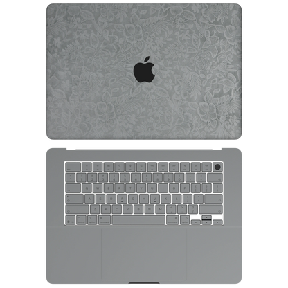 Classic Gray Hibiscus synthetic leather: Top+Inside coverage guide: embossed top lid (A), plain inside (C) and keycap stickers. No bottom (D) or screen-edge (B) pieces. Rendered on Air 15.3-inch M3-M5 as shared Air/Pro/Neo material reference; exact cutouts follow selected model.