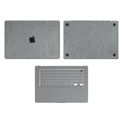 Classic Gray Hibiscus synthetic leather: Top Inside & Bottom Wraps coverage guide: embossed top lid (A) and bottom (D), plain inside (C) and keycap stickers. No screen-edge (B) pieces. Rendered on Air 15.3-inch M3-M5 as shared Air/Pro/Neo material reference; exact cutouts follow selected model.