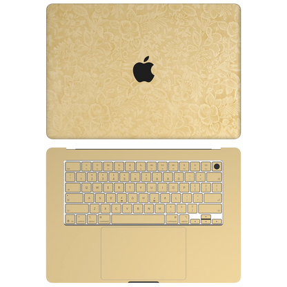 Vintage Gold Hibiscus synthetic leather: Top+Inside coverage guide: embossed top lid (A), plain inside (C) and keycap stickers. No bottom (D) or screen-edge (B) pieces. Rendered on Air 15.3-inch M3-M5 as shared Air/Pro/Neo material reference; exact cutouts follow selected model.