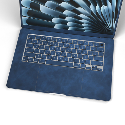 Dark Gray Blue scrub-textured synthetic leather MacBook skin. Wide keyboard and inside material detail. Air 15.3 M3-M5 shared material/installation reference; exact cutouts and included pieces follow selected model and coverage. Laptop not included.