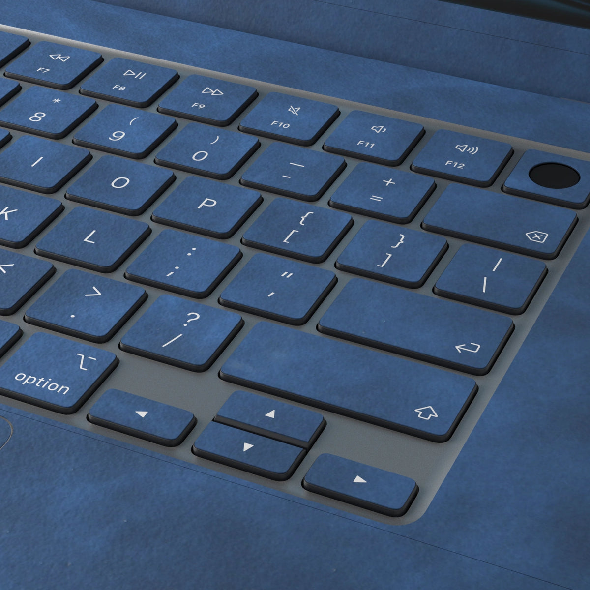 Dark Gray Blue scrub-textured synthetic leather MacBook skin. Close-up of the actual scrub-textured material finish. Air 15.3 M3-M5 shared material/installation reference; exact cutouts and included pieces follow selected model and coverage. Laptop not included.