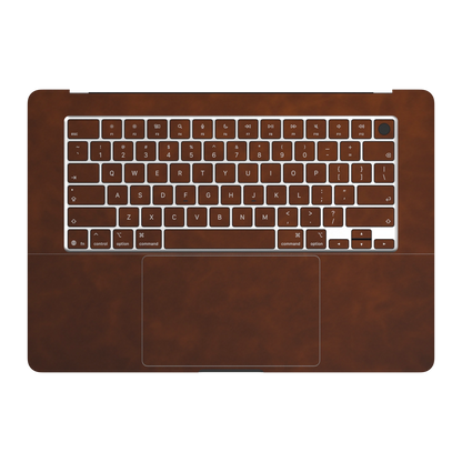 Coffee Brown scrub-textured synthetic leather MacBook skin. Inside (C) and matching keycap sticker material illustration. Air 15.3 M3-M5 shared material/installation reference; exact cutouts and included pieces follow the selected model and coverage. Laptop not included.