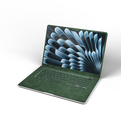 Green scrub-textured synthetic leather MacBook skin. Open front material illustration. Air 15.3 M3-M5 shared material/installation reference; exact cutouts and included pieces follow selected model and coverage. Laptop not included.