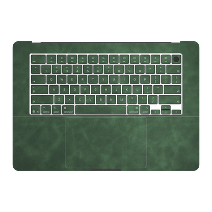 Green scrub-textured synthetic leather MacBook skin. Inside (C) and matching keycap material illustration. Air 15.3 M3-M5 shared material/installation reference; exact cutouts and included pieces follow selected model and coverage. Laptop not included.