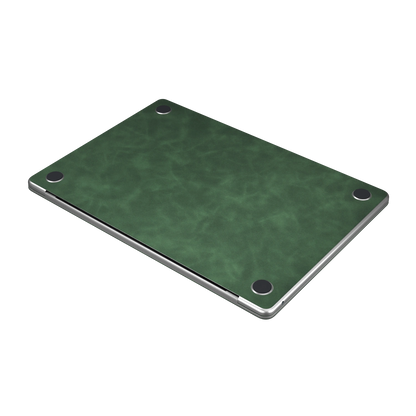 Green scrub-textured synthetic leather MacBook skin. Bottom material detail. Air 15.3 M3-M5 shared material/installation reference; exact cutouts and included pieces follow selected model and coverage. Laptop not included.