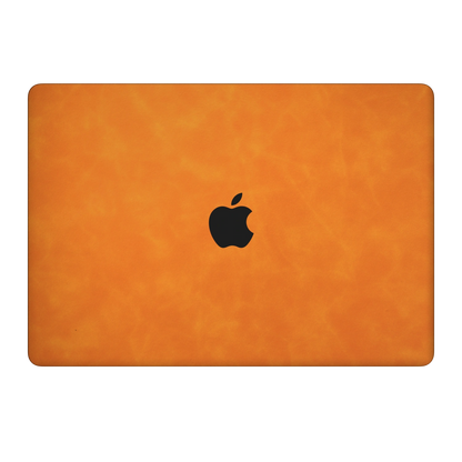 Orange scrub-textured synthetic leather MacBook skin. Top Lid coverage: A only. Air 15.3 M3-M5 shared material/installation illustration; actual cutouts and included pieces follow the selected model and coverage. Laptop not included.