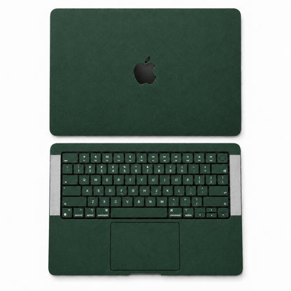 Green synthetic leather MacBook skin illustration: lid and inside with keycaps.