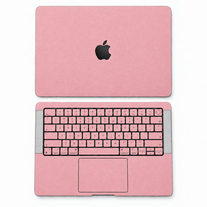 Pink synthetic leather MacBook skin illustration: lid and inside with keycaps.